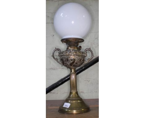 An embossed brass twin handled oil lamp, The New Rochester Jr with  decorated bowl and milk glass shade.  The bowl appears to