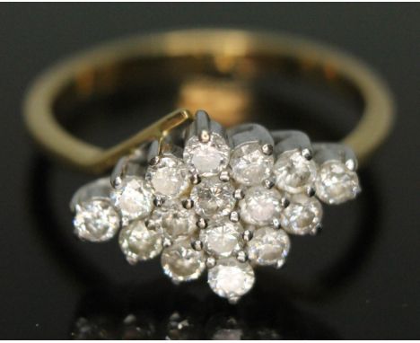 A diamond cluster ring, the marquis cluster measuring 16mm x 10mm, hallmarks indistinct, gross wt. 5.71g, size U.  
