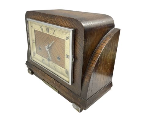 An oak cased German Art Deco 20th century three train Westminster chiming mantle clock striking the hours and chiming the qua