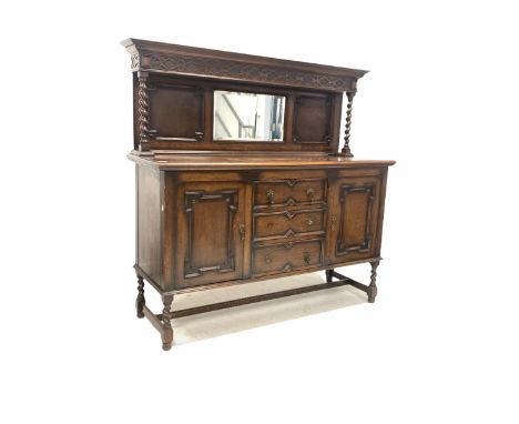 Early 20th century oak sideboard, the raised back with cornice over blind fret carved frieze, two geometric panels and bevell