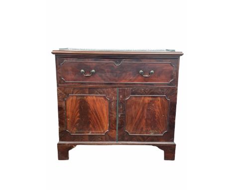 Georgian mahogany secretaire, the pierced brass galleried top over pull out fall front drawer revealing fitted interior, two 