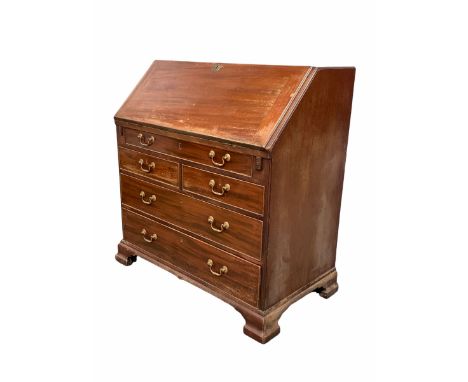 George III mahogany bureau, the fall front revealing interior well fitted with inset writing surface, correspondence shelves,