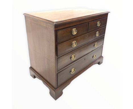 George III mahogany chest, the cross banded and boxwood strung top over two short and three long graduated cock beaded drawer