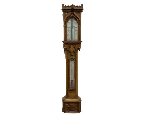 A Victorian boxwood cistern tube stick barometer manufactured by Nagretti &amp; Zambria, London, circa 1860 in an oak �Gothic