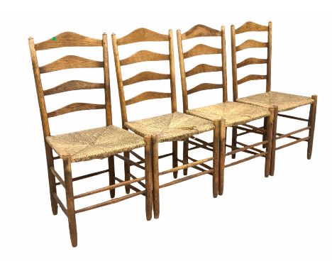 Set four 19th century oak ladder back dining chairs, with rush seats, raised on turned supports and stretchers W47cm