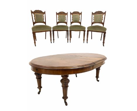 Victorian mahogany extending dining table, the oval top with one additional leaf raised on floral carved and fluted supports 
