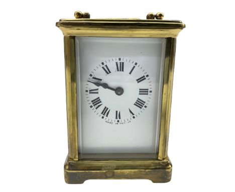 A French early 20th century eight-day Corniche timepiece carriage clock with a jewelled lever platform escapement with timing