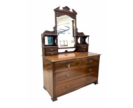 Late Victorian mahogany dressing chest, the raised back with swing mirror and four trinket drawers over two short and two lon