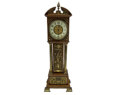 An Edwardian oak miniature longcase clock with a broken pediment and central brass finial, hood with applied brass spandrels 