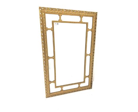 Ornate gilt framed wall mirror with beaded border and scrolled acanthus leaf  decoration to frame 53cm x 84cm