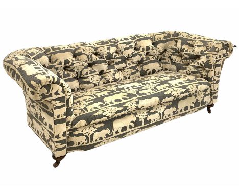 Victorian chesterfield sofa, upholstered in Andrew Martin deep buttoned animal print velvet fabric, raised on turned supports