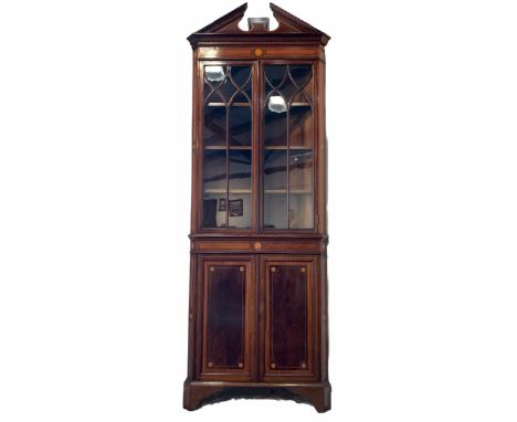 Quality Edwardian Sheraton revival floor standing corner cupboard, broken arch pediment over dentil cornice, two astragal gla