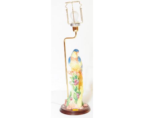 A contemporary Meissen style parrot table light lamp base. With polychrome painted ceramic parrot on a perch with foliate and