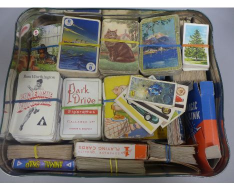 A tin of vintage playing cards 