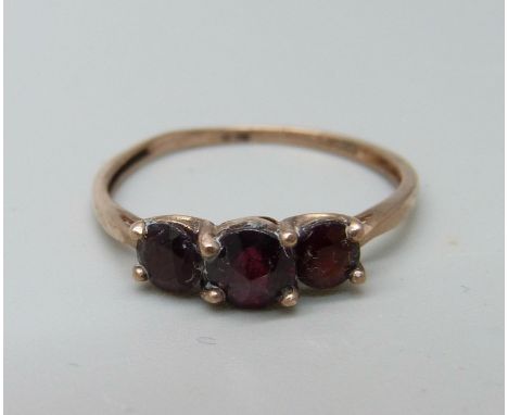 A 9ct gold and three stone garnet ring, 1.2g, P 