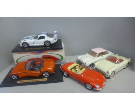 A collection of vintage model 1/18 scale cars with two E-Type Jaguars and Dodge Concept Vehicle 