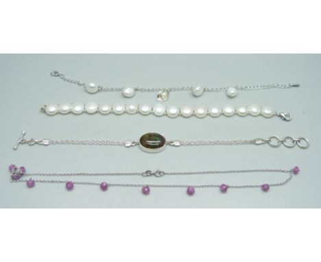 Two sterling silver and baroque pearl bracelets, a sterling silver and black boulder opal bracelet and a silver necklace 