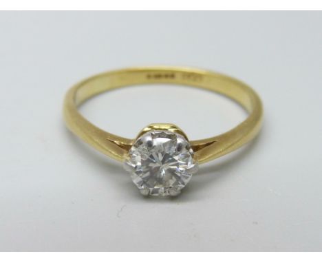 An 18ct gold and diamond solitaire ring, approximately 0.78 carat diamond weight, 3.1g, R 