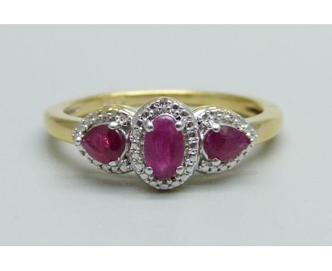 A silver gilt, ruby and diamond accent ring, N 