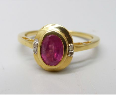 A silver gilt and ruby ring with four diamond accents, V 
