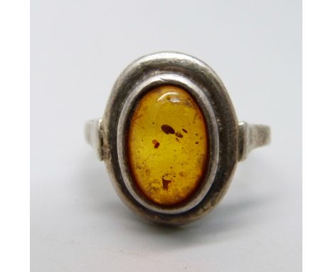 A silver and amber ring, J 