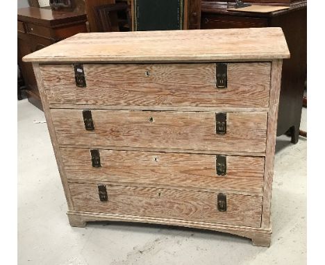 A 19th Century Continental pitch pine commode of four long drawers with aesthetic style brass drop handles raised on bracket 
