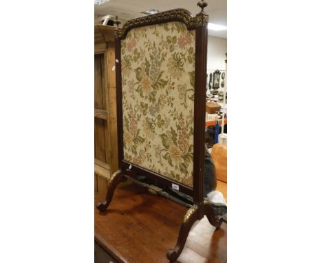 A circa 1900 mahogany and gilt brass embellished fire screen in the Louis XVI taste, the top rail with laurel decoration flan