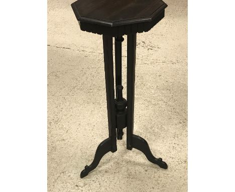 An early 20th Century Anglo-Indian coromandel lamp table, the octagonal top with moulded edge over a dentil cornice raised on