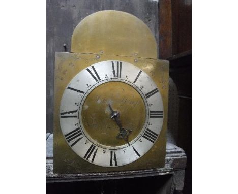 A late 18th Century oak cased long case clock of small proportions, the thirty hour movement with brass arch dial, the silver