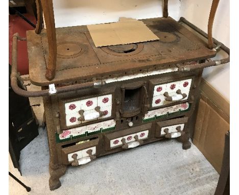 A French enamel kitchen range with tiled decoration