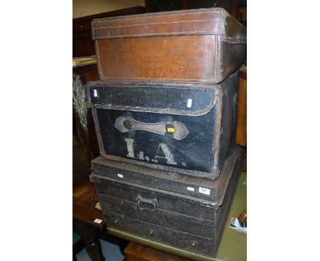 A Victorian canvas and leather bound trunk by JC Sweeney of Newcastle on Tyne 79 cm x 52 cm x 33.5 cm, a heavy leather suitca
