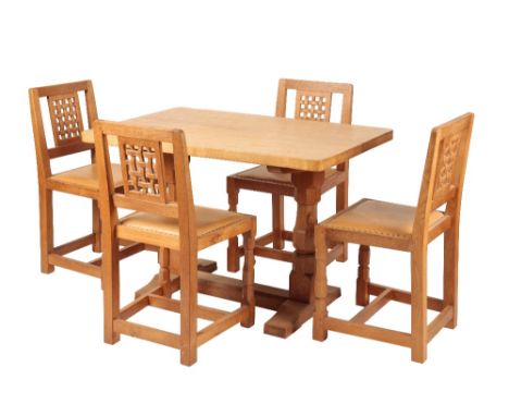 ROBERT THOMPSON "MOUSEMAN": AN OAK DINING TABLE AND FOUR CHAIRS, the rectangular form adzed top, raised on two octagonal colu