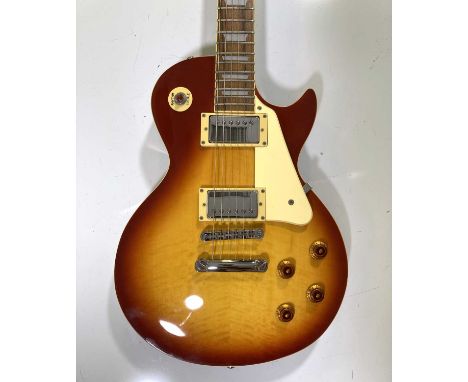 A c 1997 Epiphone Les Paul six string electric guitar with hard case. Serial number reads: F97040677. Some light marks/scuffs