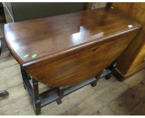 A gate leg table and a display cabinet