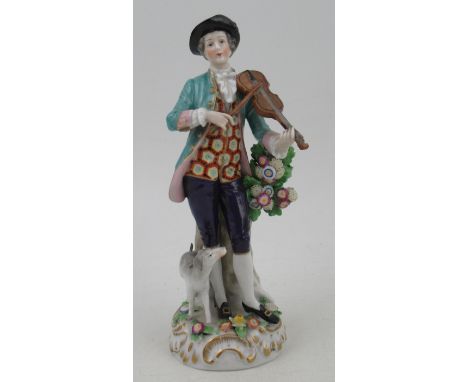 A Continental porcelain figure, of a man playing a violin with dog by his side, height 8ins