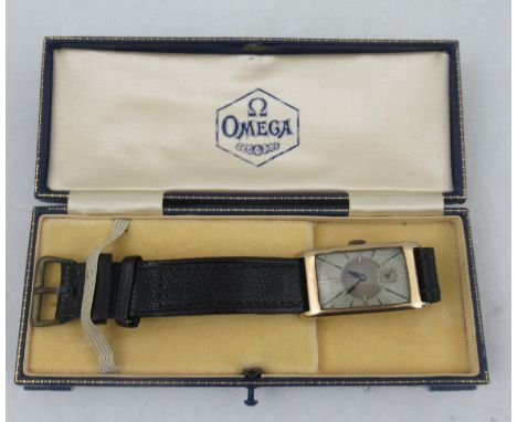 A 9ct gold case Omega wrist watch, with rectangular silvered dial and batons, the case marked Dennison, in an Omega leather c