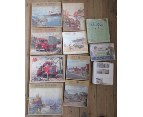 A collection of Chad Valley wooden jig-saw puzzles, together with booklets