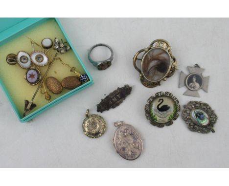 A collection of jewellery, to include a silver locket, Victorian and later brooches, stick pins, cuff links etc