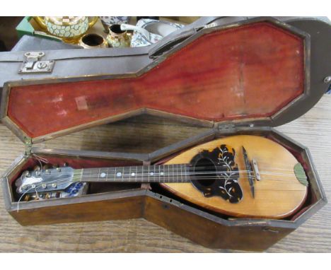 A mandolin, with mahogany case