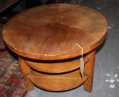 An Art Deco style circular faded walnut three tier occasional table.