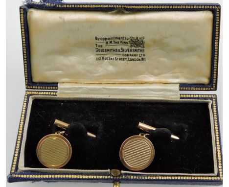 A pair of mid-20th century 9ct gold circular chain cufflinks, with engine turned decoration, 8.7g.