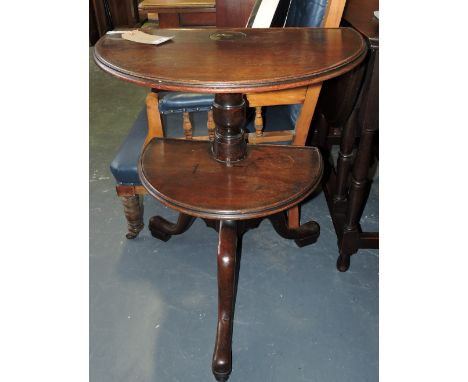 A George III mahogany dumbwaiter, the two-tiers later cut to D-shape on turned column and cabriole tripod.