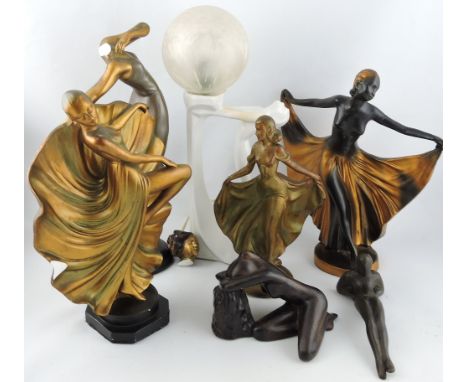 A white ceramic Art Deco style table lamp, in the form of a female figure supporting a globe, six further Art Deco style figu