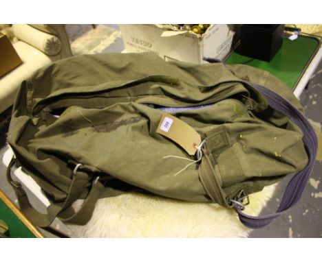 A German issue kit bag containing assorted vintage gentleman's clothing including a green parker coat.