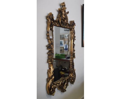 A Chippendale style rectangular gilt frame wall mirror with pierced shell scroll frame.