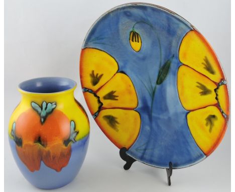 A Poole Pottery Wild Pottery charger, painted by Patricia Wells, D. 40cm; together with a similar baluster vase. (2)