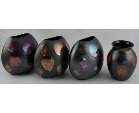 Three Poole Pottery matte black Galaxy small purse vases, H. 19cm; together with an similar squat baluster shaped vase. (4)