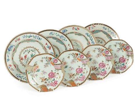A set of four Chinese famille rose plates, Qianlong, decorated flowers in enamels, 23cm diameter and four octagonal saucers, 