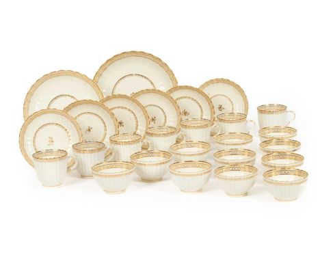 A Caughley reeded white and gilt part tea service, circa 1790, decorated with circle and dot band, comprising eleven tea bowl