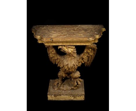 A George II gilt gesso serpentine eagle console table, in the manner of William Kent, with foliate frieze on displayed winged